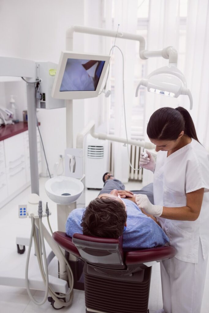 female dentist examining patient 107420 65604